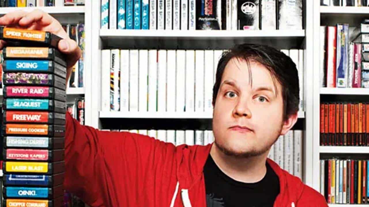 Chris Kohler with a stack of games