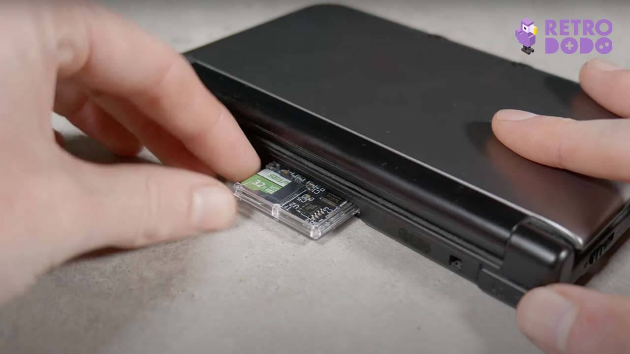 Rob pushing the EZ Flash into his 3DS