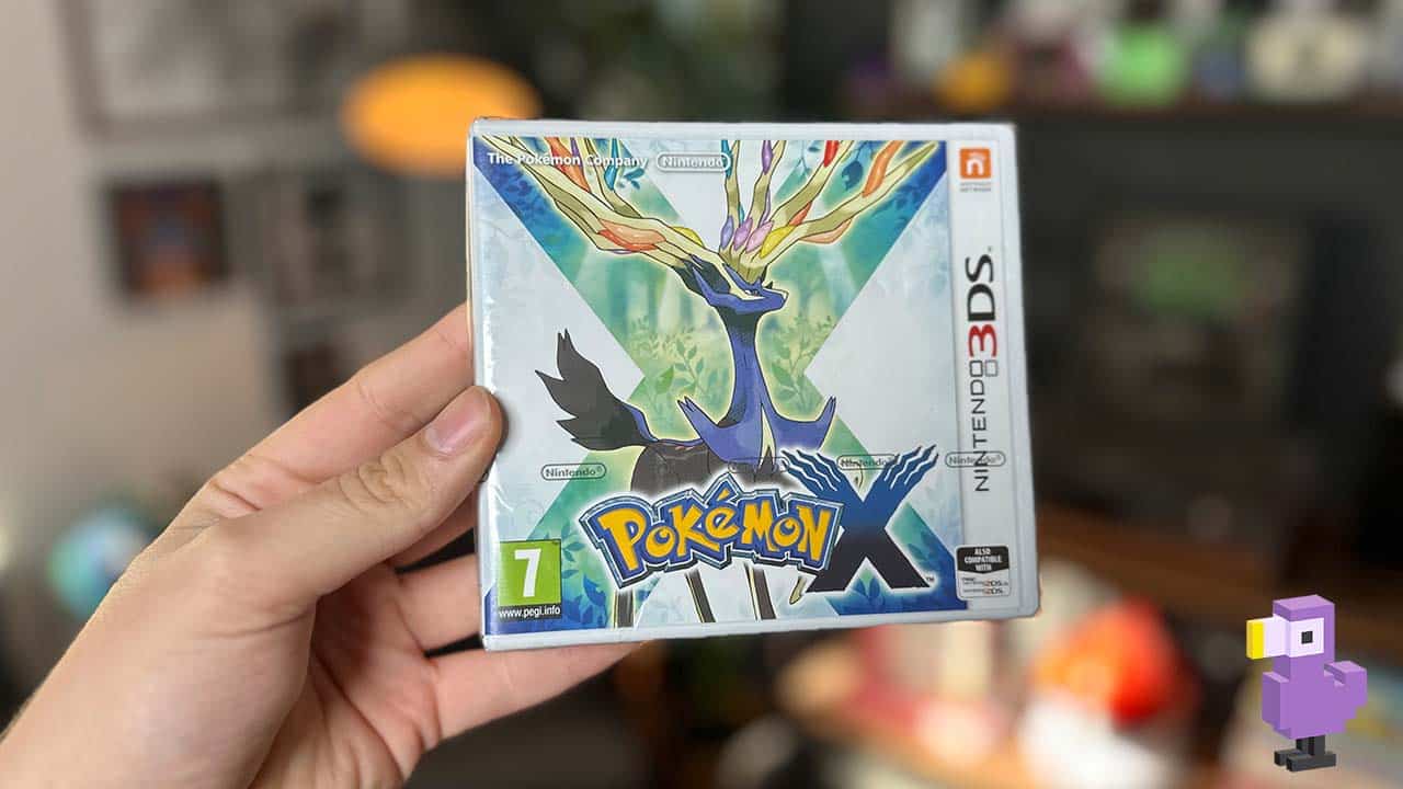 Pokemon x 3ds game box in Brandon's hand