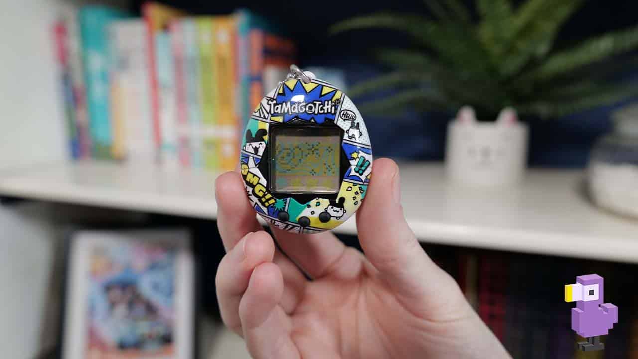 Tamagotchi held in Brandon's hand